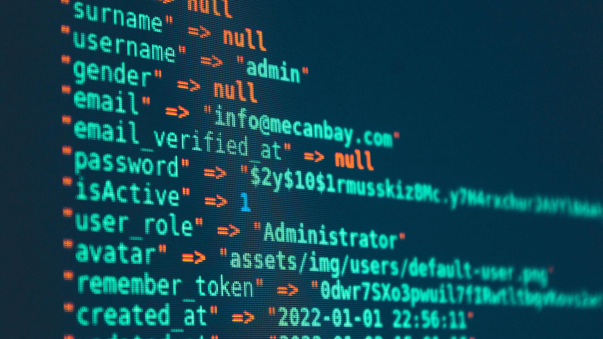 Lines of code on a dark screen, in green and orange