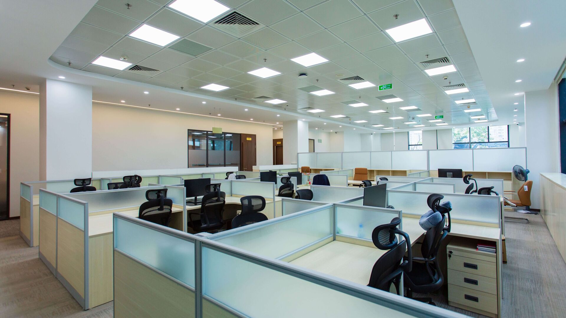 An open-plan office with rows of workstations